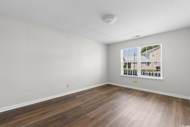 408 Chesterfield Ct, Myrtle Beach, SC 29577 - unfurnished room with dark wood-style flooring, a textured ceiling, and baseboards