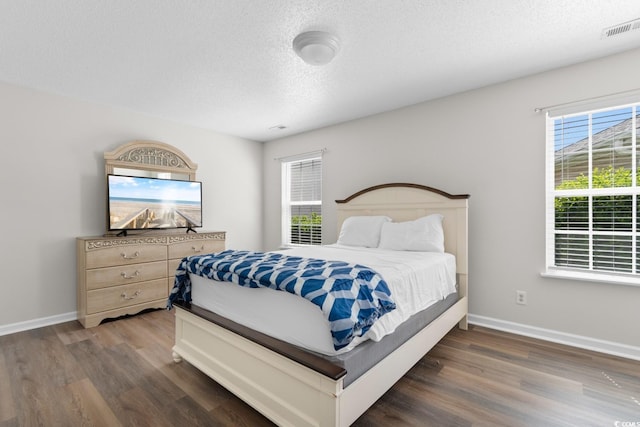 408 Chesterfield Ct, Myrtle Beach, SC 29577 - bedroom featuring wood finished floors, a textured ceiling, and baseboards