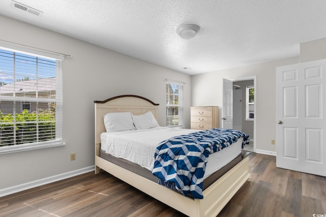408 Chesterfield Ct, Myrtle Beach, SC 29577 - bedroom featuring a textured ceiling, wood finished floors, and baseboards