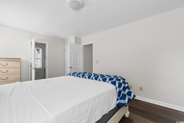 408 Chesterfield Ct, Myrtle Beach, SC 29577 - bedroom with wood finished floors, baseboards, and a textured ceiling