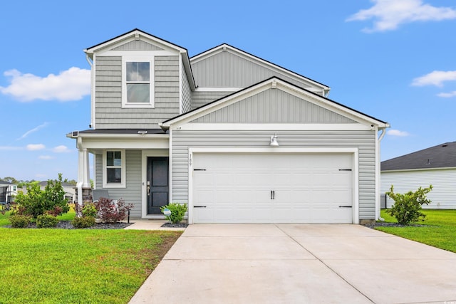 189 Timber Oaks Dr, Myrtle Beach, SC 29588 - traditional-style house with a front lawn, concrete driveway, board and batten siding, and a garage