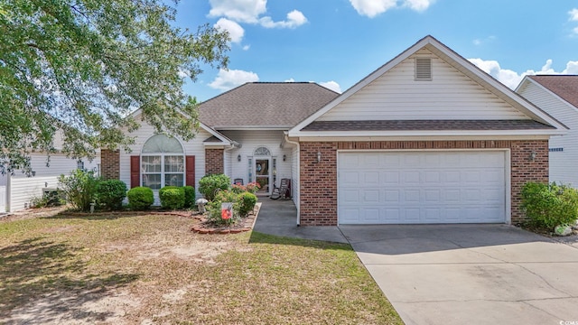 view of front of house with brick siding, a shingled roof, an attached garage, and concrete driveway