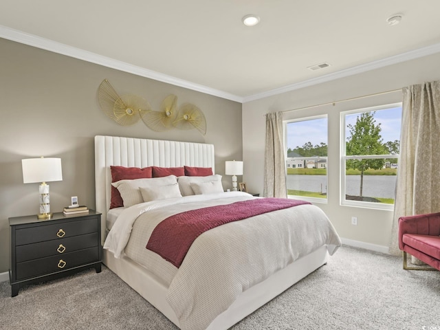 carpeted bedroom with crown molding, a water view, baseboards, and visible vents