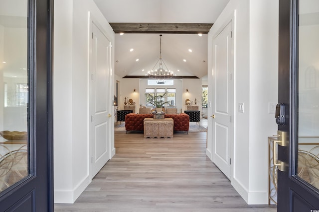 foyer with recessed lighting, vaulted ceiling with beams, light wood finished floors, and a notable chandelier