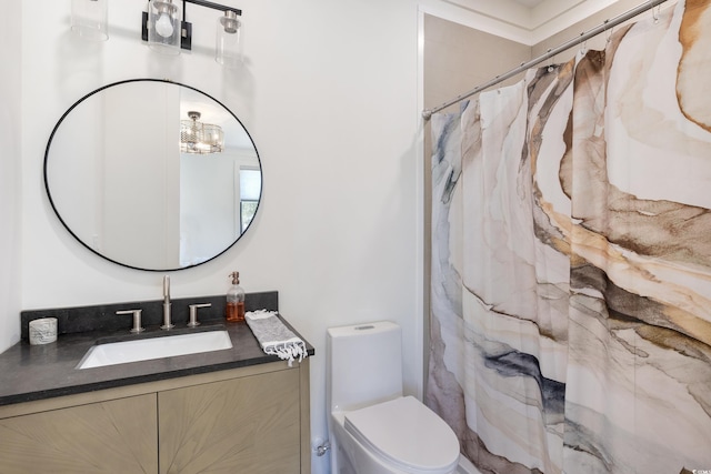 bathroom featuring toilet, a shower with curtain, and vanity