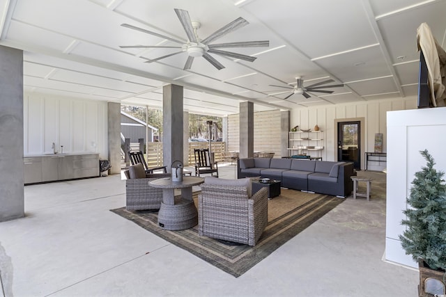 living area with concrete flooring, floor to ceiling windows, and a ceiling fan