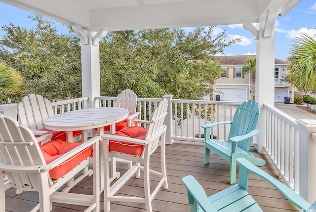 wooden terrace featuring outdoor dining space