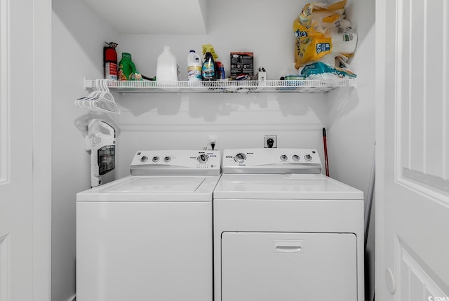 washroom featuring washer and dryer and laundry area