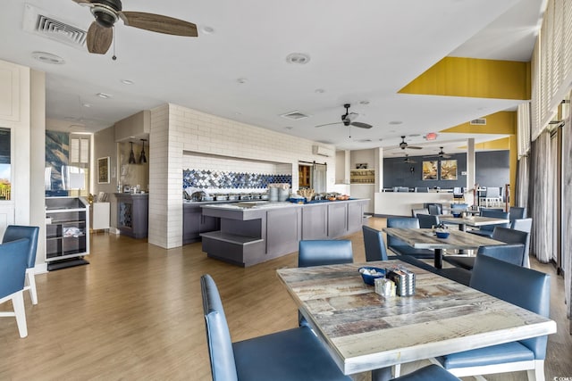 7100 Ocean Blvd N Unit 1425, Myrtle Beach, SC 29572 - dining area with a ceiling fan and light wood-style flooring