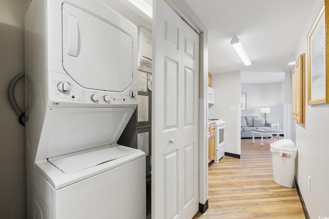 7100 Ocean Blvd N Unit 1425, Myrtle Beach, SC 29572 - laundry area with estacked washer and dryer and light wood finished floors