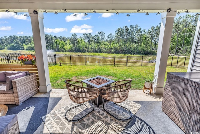 view of patio / terrace featuring a fire pit and a fenced backyard