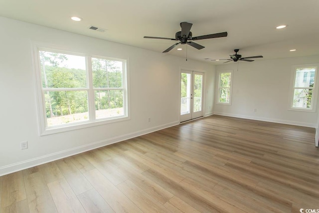 2212 Dykman Cir, Little River, SC 29566 - empty room with baseboards, wood finished floors, a ceiling fan, and recessed lighting