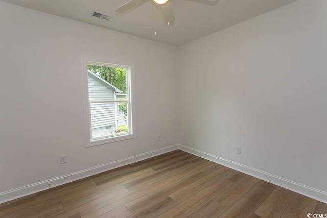 2212 Dykman Cir, Little River, SC 29566 - spare room with dark wood finished floors, baseboards, and ceiling fan