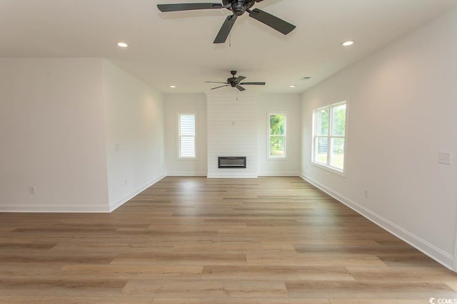 2212 Dykman Cir, Little River, SC 29566 - unfurnished living room with healthy amount of natural light, recessed lighting, a ceiling fan, and baseboards