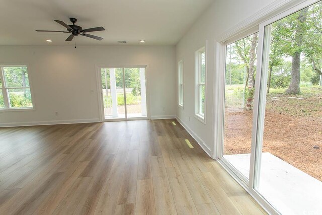 2212 Dykman Cir, Little River, SC 29566 - empty room with plenty of natural light, light wood-style floors, recessed lighting, and baseboards