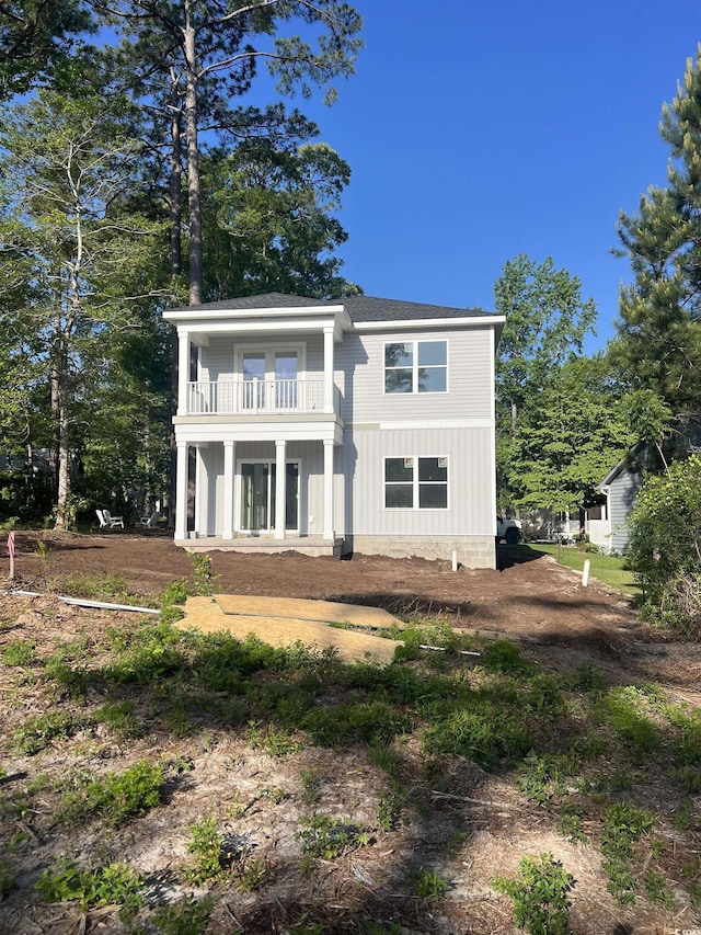 rear view of house with a balcony
