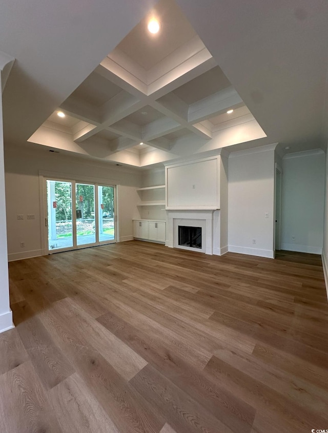 924 Morrall Dr, North Myrtle Beach, SC 29582 - unfurnished living room with wood finished floors, recessed lighting, crown molding, beam ceiling, and a fireplace