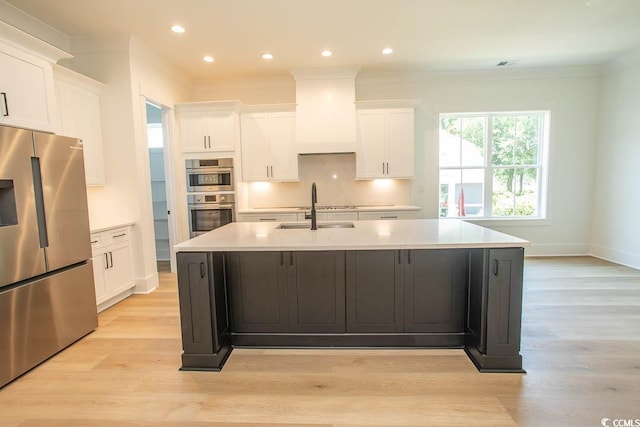 924 Morrall Dr, North Myrtle Beach, SC 29582 - kitchen with stainless steel appliances, an island with sink, white cabinetry, light countertops, and recessed lighting
