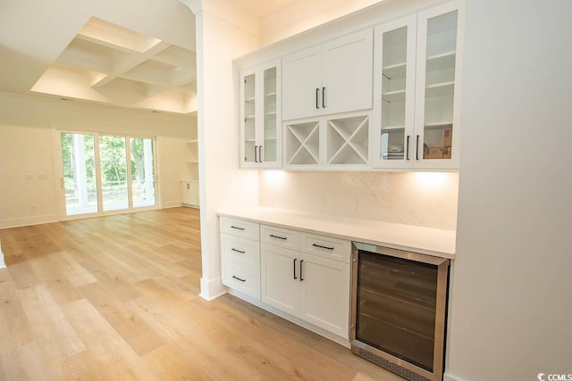 924 Morrall Dr, North Myrtle Beach, SC 29582 - indoor dry bar with wine cooler, coffered ceiling, backsplash, light wood-style flooring, and beam ceiling