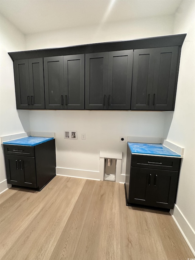 924 Morrall Dr, North Myrtle Beach, SC 29582 - laundry room with cabinet space, hookup for a washing machine, light wood finished floors, and electric dryer hookup