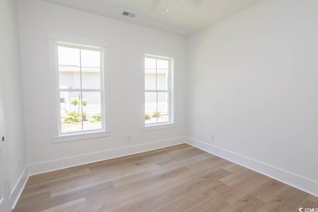924 Morrall Dr, North Myrtle Beach, SC 29582 - empty room with light wood-type flooring, plenty of natural light, and ceiling fan