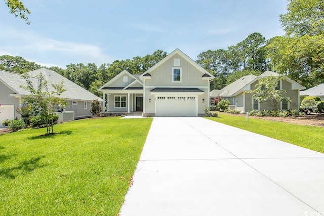 924 Morrall Dr, North Myrtle Beach, SC 29582 - craftsman inspired home with board and batten siding, driveway, a front lawn, and a garage