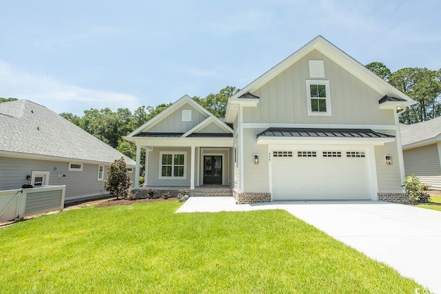 924 Morrall Dr, North Myrtle Beach, SC 29582 - view of front facade with a standing seam roof, board and batten siding, driveway, a porch, and a front yard