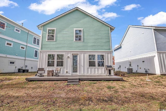back of house with a yard, central AC, and a wooden deck