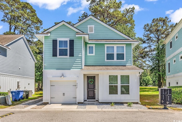 view of front of house featuring a garage, a shingled roof, and board and batten siding