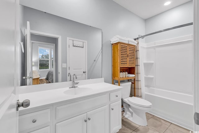 full bathroom with toilet,  shower combination, tile patterned flooring, and vanity