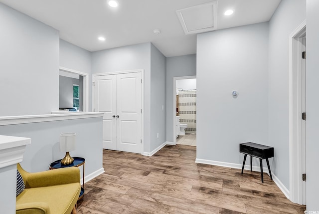 sitting room with recessed lighting, baseboards, and wood finished floors