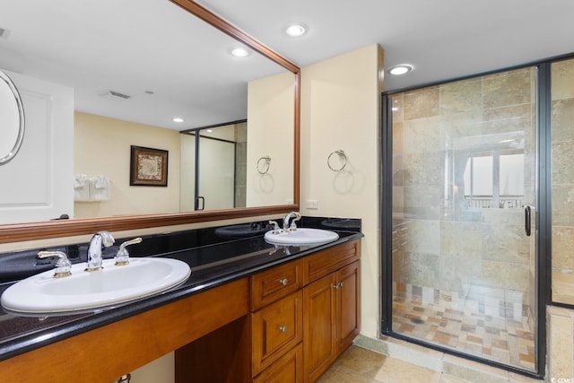 full bathroom with visible vents, a sink, recessed lighting, and a shower stall