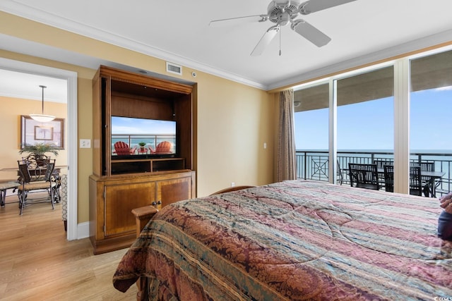 bedroom with light wood-style floors, access to exterior, baseboards, visible vents, and ornamental molding