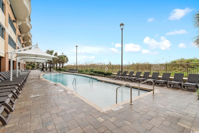 community pool featuring a patio area