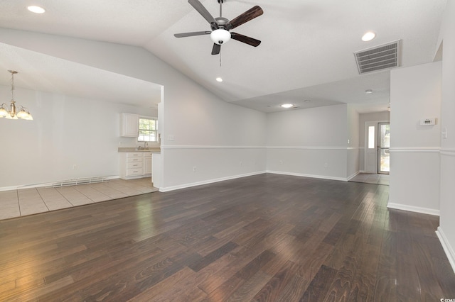 unfurnished living room featuring visible vents, wood finished floors, lofted ceiling, recessed lighting, and ceiling fan with notable chandelier