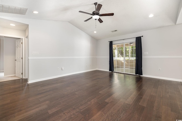 empty room with visible vents, a ceiling fan, dark wood-type flooring, and lofted ceiling