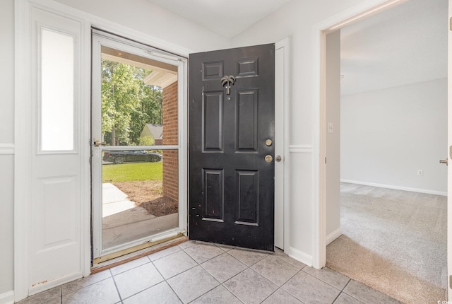 entryway featuring light tile patterned floors and baseboards