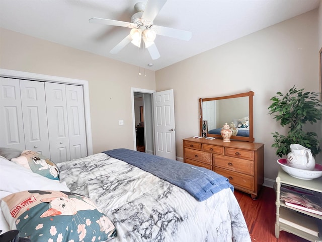 bedroom with ceiling fan, a closet, and wood finished floors