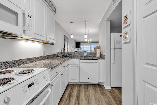 1581 S Waccamaw Dr Unit 302, Garden City Beach, SC 29576 - kitchen featuring a sink, white cabinets, white appliances, and dark wood-style floors