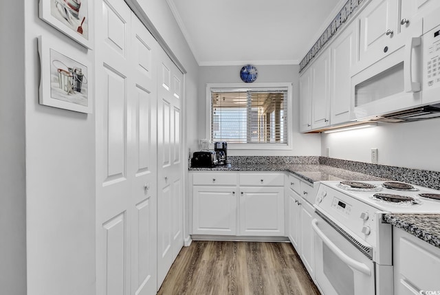 1581 S Waccamaw Dr Unit 302, Garden City Beach, SC 29576 - kitchen featuring crown molding, white cabinets, white appliances, dark stone counters, and wood finished floors