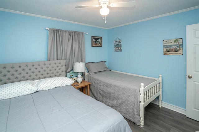 bedroom with baseboards, ornamental molding, a ceiling fan, and wood finished floors