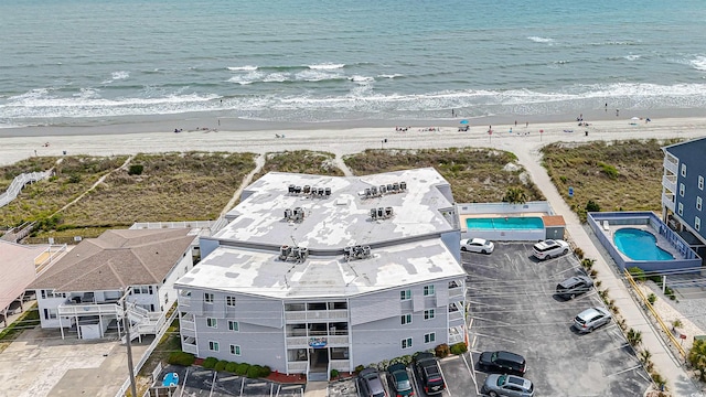bird's eye view featuring a beach view and a water view