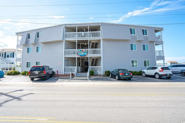 view of property featuring uncovered parking