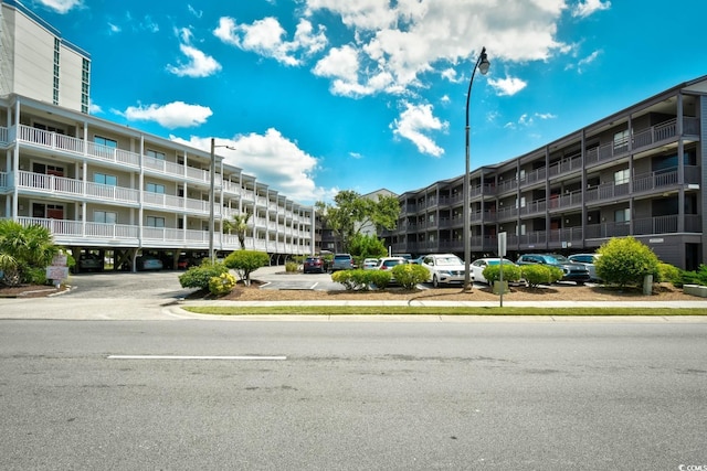 view of property with uncovered parking