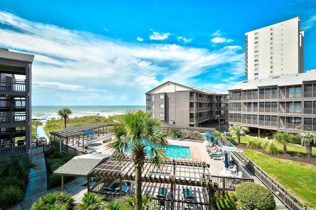 community pool featuring a water view