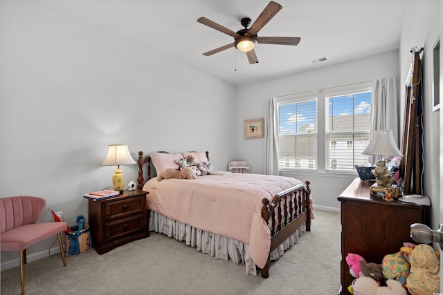 bedroom with light colored carpet, baseboards, visible vents, and a ceiling fan