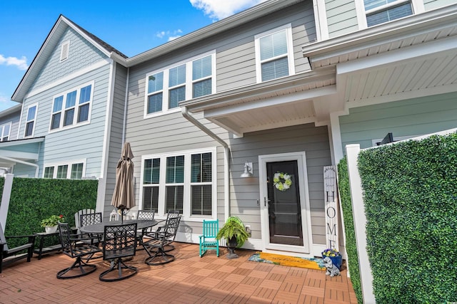 exterior space with a patio and outdoor dining area