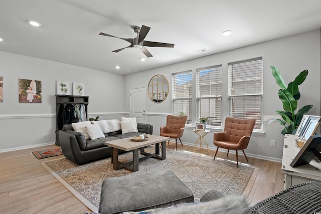 living area featuring ceiling fan, visible vents, wood finished floors, baseboards, and recessed lighting