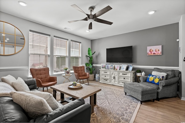 living area with visible vents, a ceiling fan, recessed lighting, and light wood-type flooring