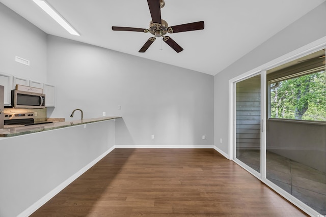 1260 White Tree Ln Unit F, Myrtle Beach, SC 29588 - unfurnished dining area with a ceiling fan, visible vents, baseboards, lofted ceiling, and dark wood-type flooring